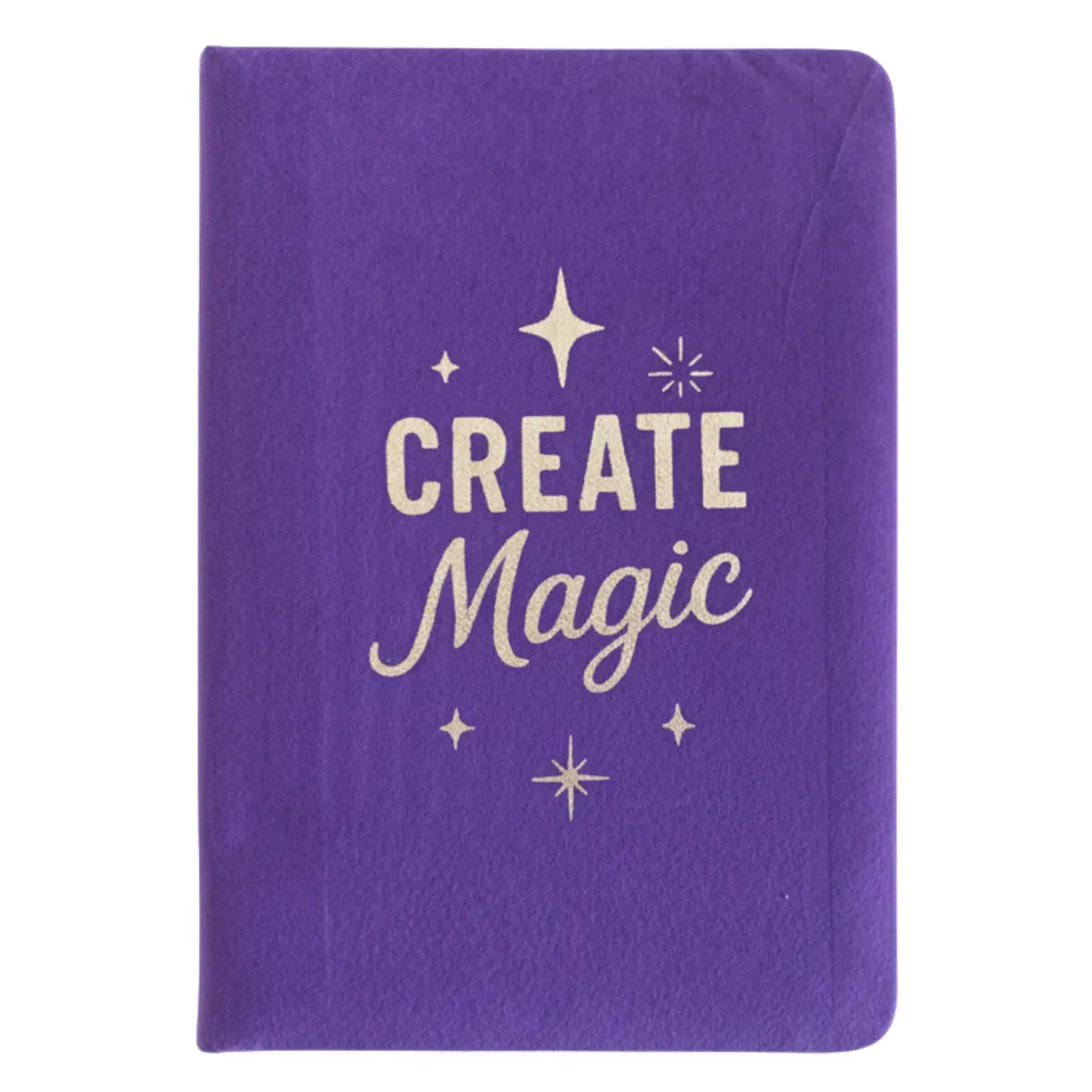 Lila anteckningsbok i sammet med texten Create Magic på omslaget