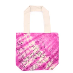Batikkamönstrad bomullsväska i magenta med mönster av ansikten och blommor