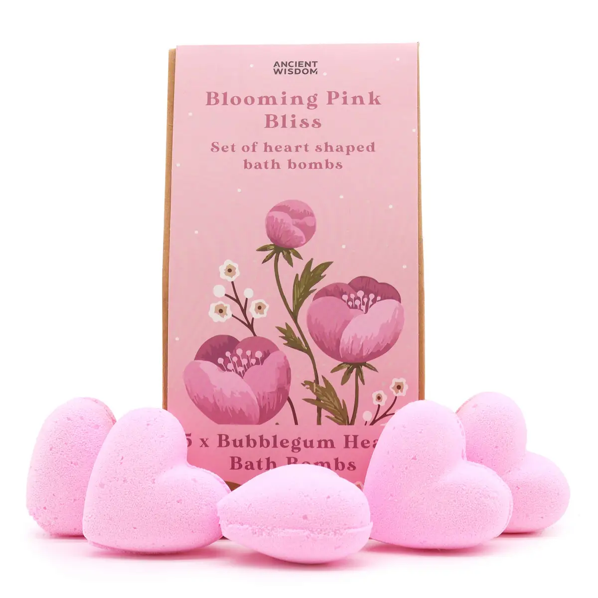 Fem rosa hjärtformade badbomber framför en rosa presentask med blommotiv
