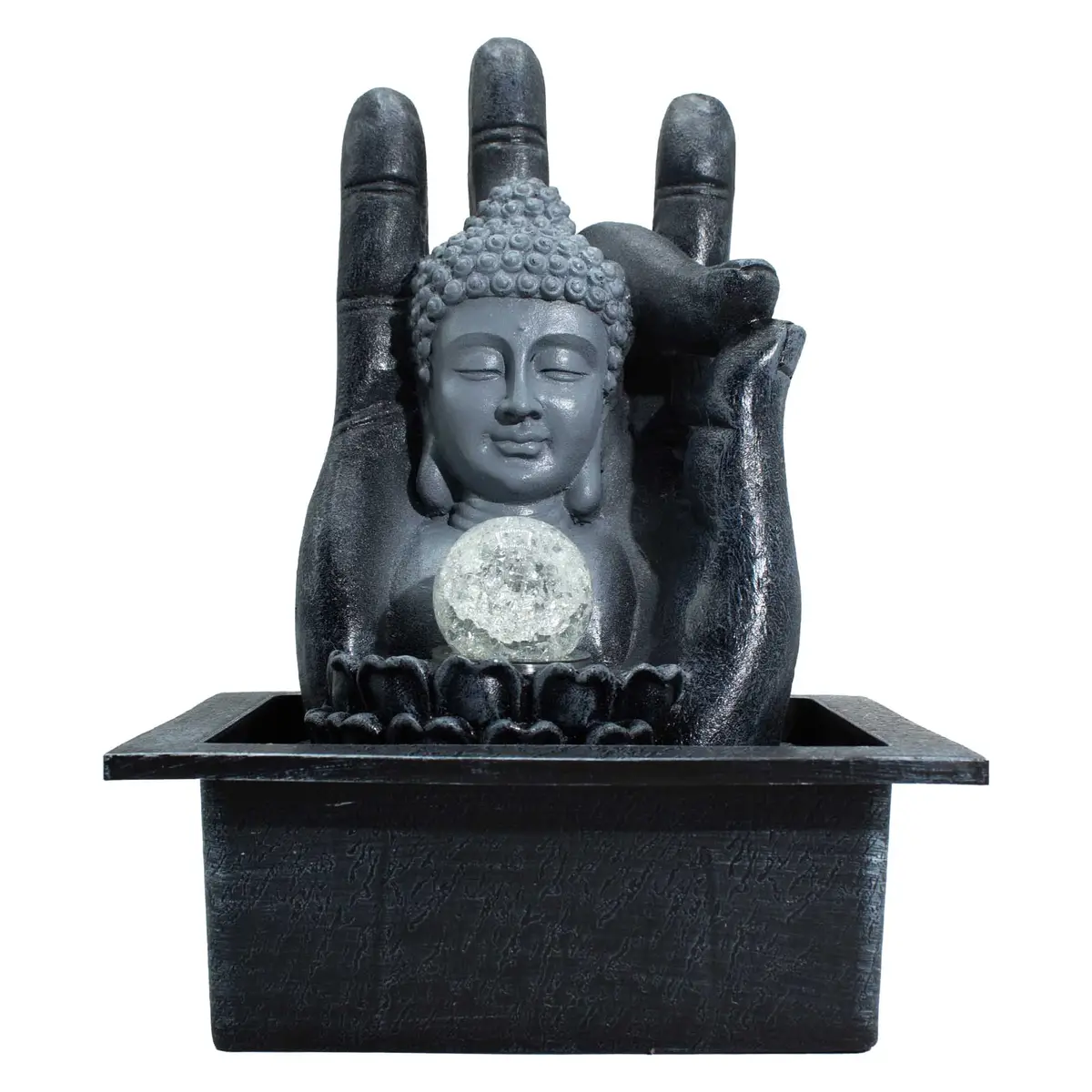 Bordsvatteninstallation med Buddhafigur i en öppen hand och upplyst kristallkula
