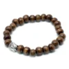 Brunt armband med träpärlor och Buddha-berlock