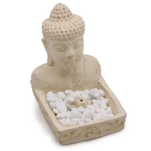 Krämfärgad buddha rökelsehållare i sten med vita dekorationsstenar