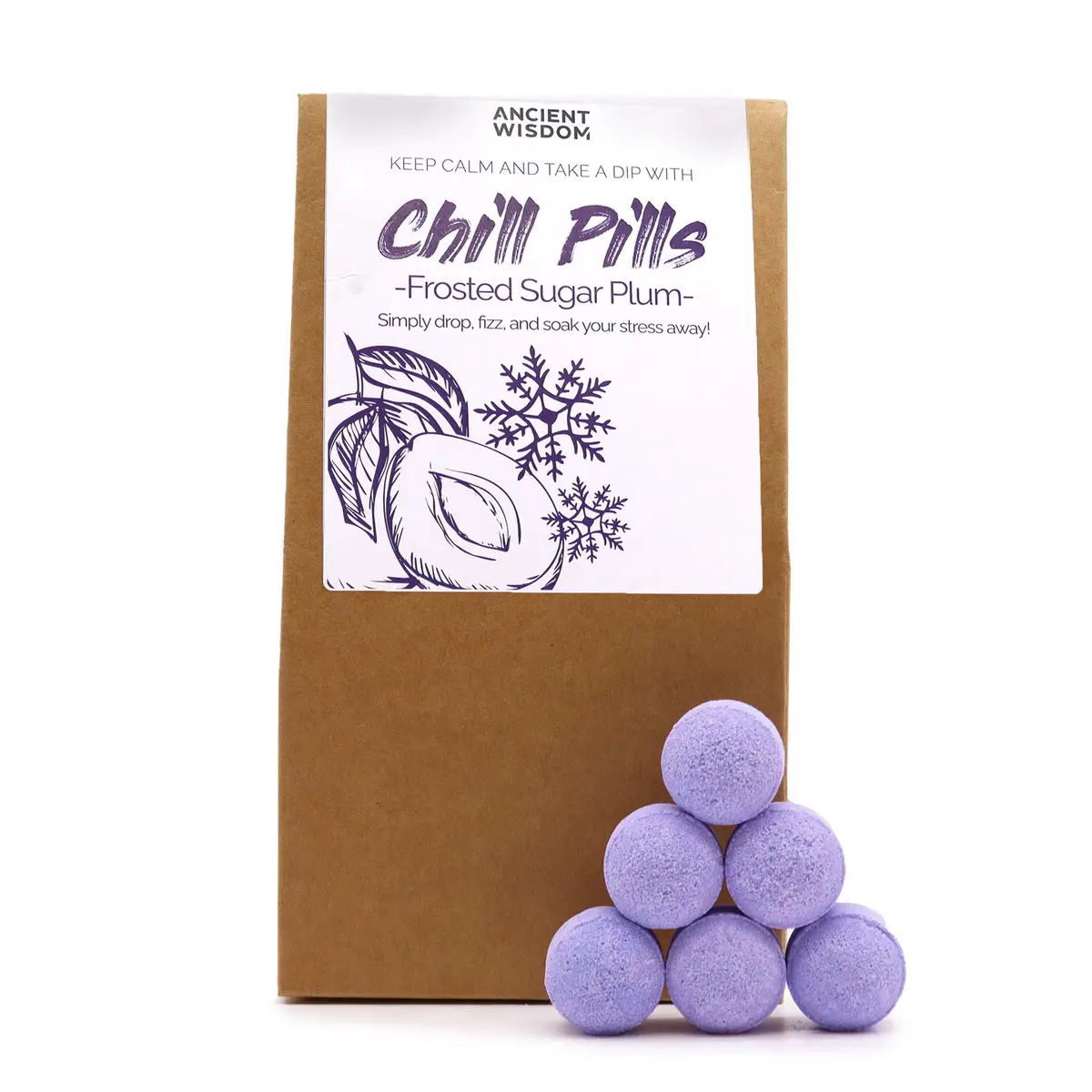 Brunt presentpaket med Chill Pills badbomber i lila färg staplade framför