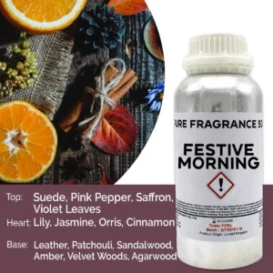 Flaska med doftolja Festive Morning 500 ml och apelsin, kanel och höstlöv i bakgrunden