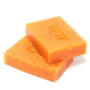 Tvålkakor i orange färg med texten Greenman Soap