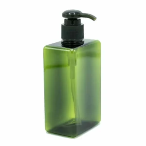 Grön plastflaska med pump dispenser för vätskor