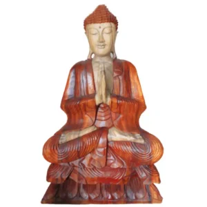 Handskuren Buddha-staty i Suarträ sittande med händerna i bönposition