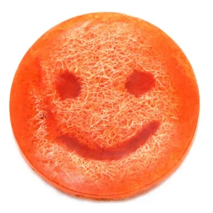 Rund orange vispad skrubbtvål med smiley-motiv