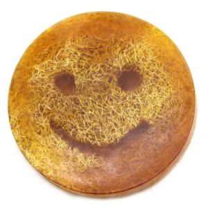Rund fast tvål med smiley-mönster och gulbrun färg