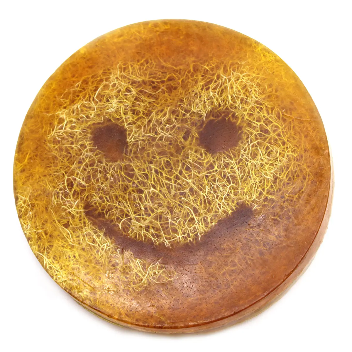 Rund fast tvål med smiley-mönster och gulbrun färg