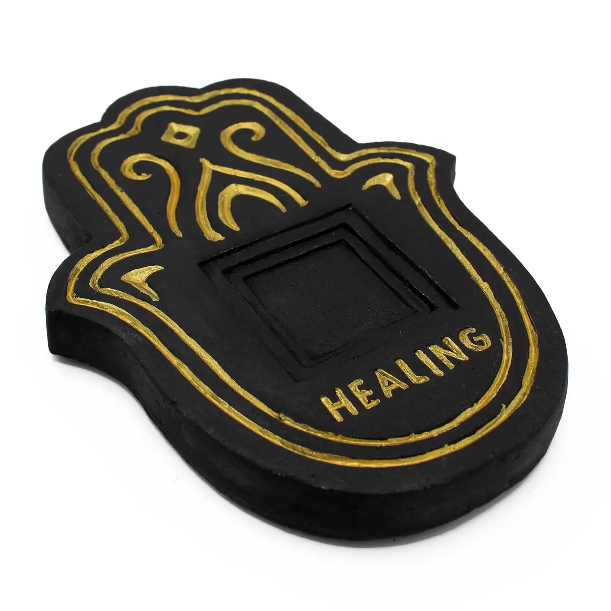 Svart rökelsefat i lavasten med gulddetaljer och texten Healing