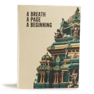 Anteckningsbok med arkitekturmotiv och texten A Breath A Page A Beginning på omslaget