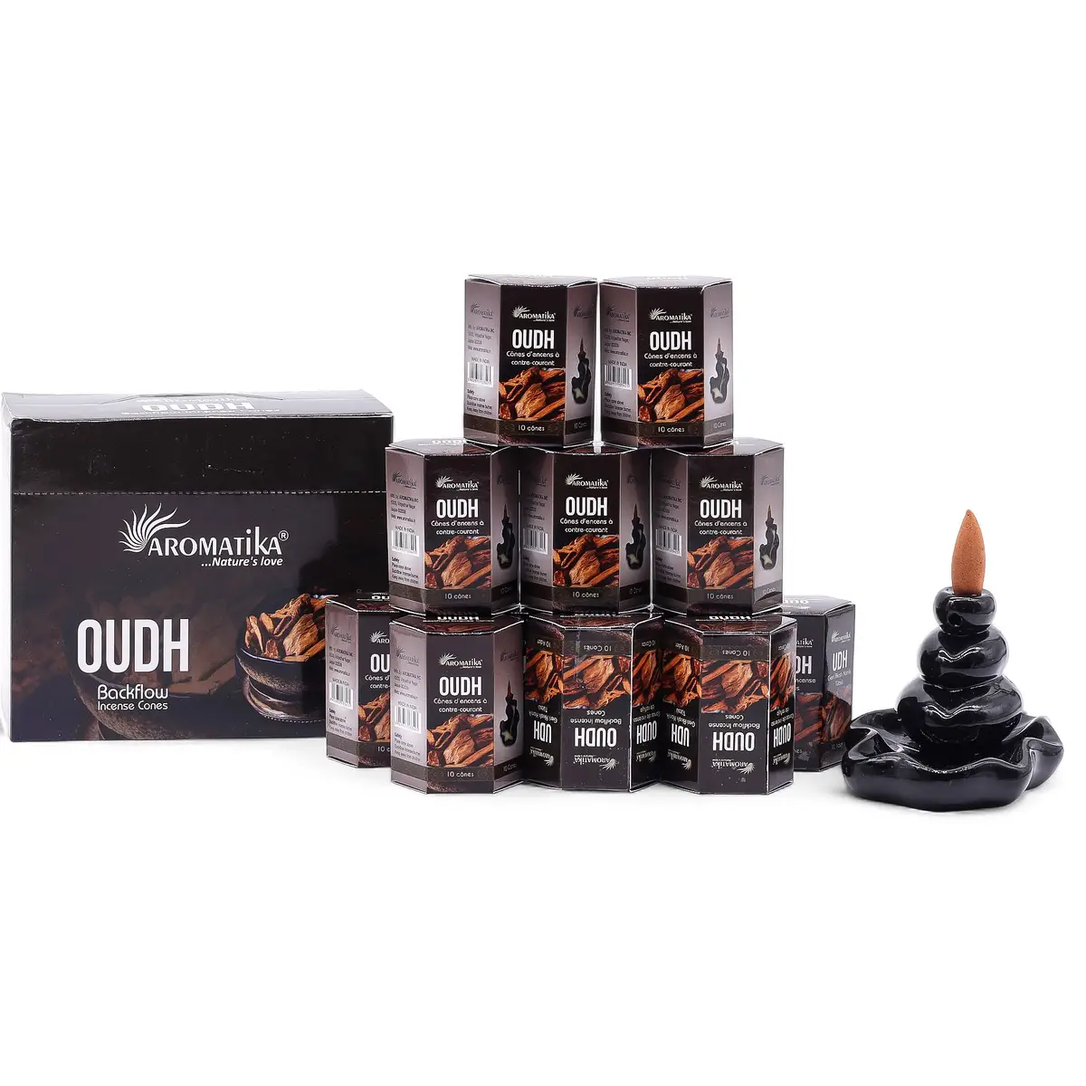 Förpackning med Aromatika Masala Backflow rökelsekoner Oudh och en svart rökelsehållare med tänd kon