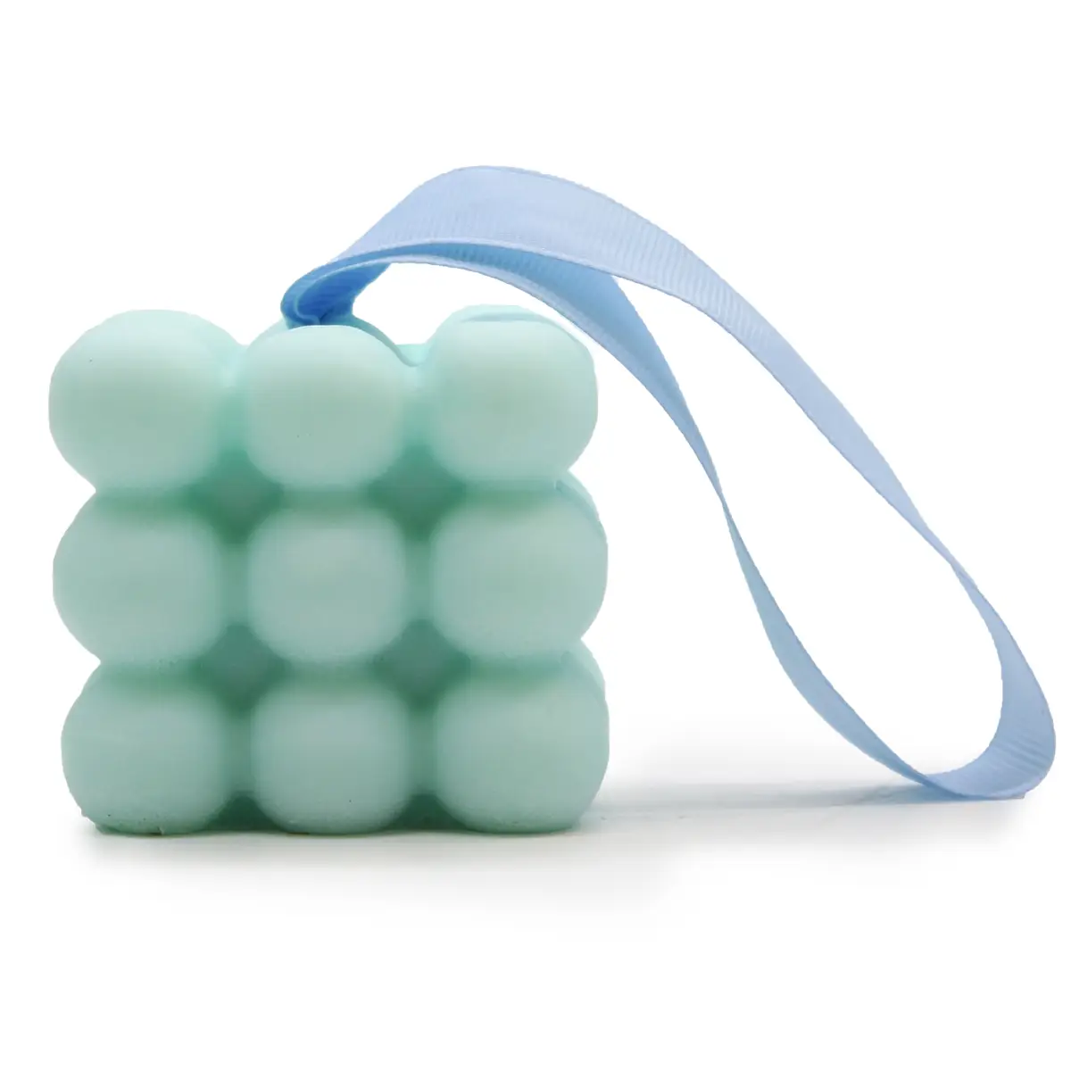 Ljusblå massage-tvål med bubbelstruktur och blått handtag