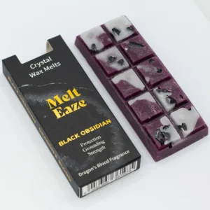 MeltEaze doftvax med svart obsidian och drakblod i svart förpackning och lila vaxbit med svarta obsidianbitar