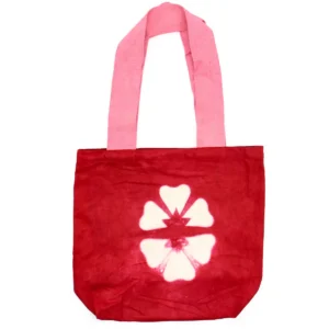 Röd batikfärgad bomullsväska med vitt blommönster och rosa handtag