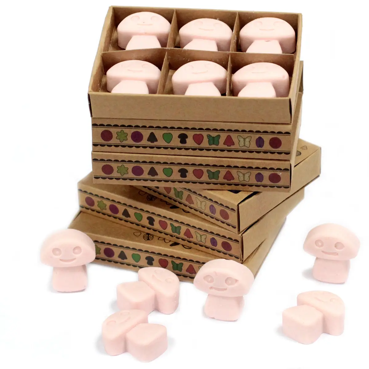 Presentförpackning med sex små rosa doftvax formade som figurer i kartongfack