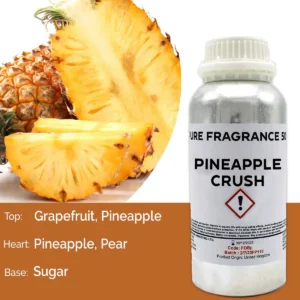 Flaska med ren doftolja Ananas Crush 500 ml bredvid skivad ananas