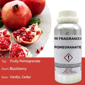 Flaska med ren doftolja granatäpple 500 ml och granatäpplen i bakgrunden