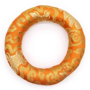 Ringkudde i orange och guldmönster för klangskål