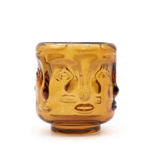 Antik bärnstensfärgad glasljuslykta med stiliserat Buddhaansikte