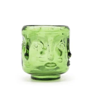 Grön glasljuslykta med upphöjda buddhaansikten