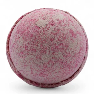 Rund rosa och beige badbomb med textur och festlig design