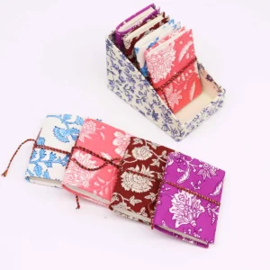 Set med 4 bomullsbandbundna anteckningsböcker med blommönster 7x10 cm - produktbild 3