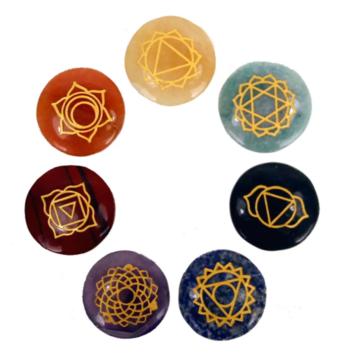 Set med sju små runda chakrastenar med guldfärgade symboler