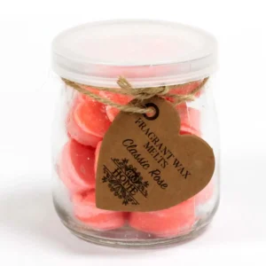 Glasburk med rosa hjärtformade sojavaxsmältor och etikett Classic Rose