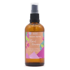 Brun glasflaska med spraypump och färgglad etikett för Floral Harmony sommardoftspray