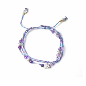 Justerbart Temple-armband i tråd med lila och blå pärlor och Buddha-berlock