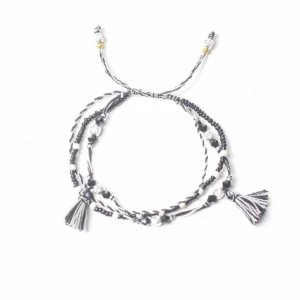 Svartvitt justerbart Temple-armband i tråd med pärlor och tofsar