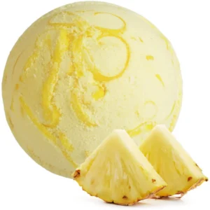 Gul badbomb med ananassdoft och två skivor färsk ananas