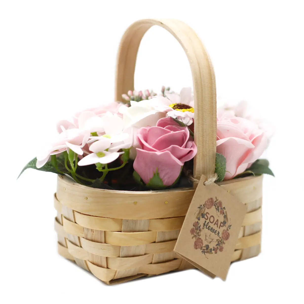 Rottingkorg med rosa tvålblommor och dekorativa blad