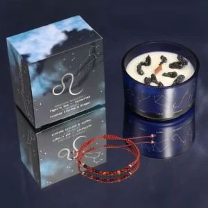 Zodiakljus i blå glasburk med stjärntecken och tillhörande rött ädelstensarmband och förpackning