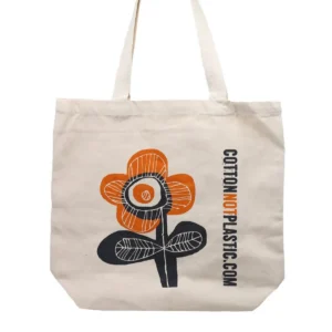 Bomullspåse med orange och svart blommönster och texten cottonnotplastic.com