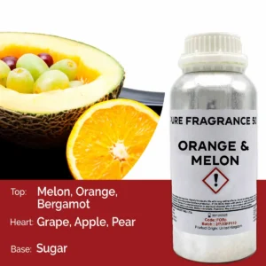 Flaska med doftolja apelsin och melon bredvid apelsin och melonfrukt