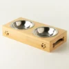 PAW Dubbel matskål i rostfritt stål med träställning 2×12 cm